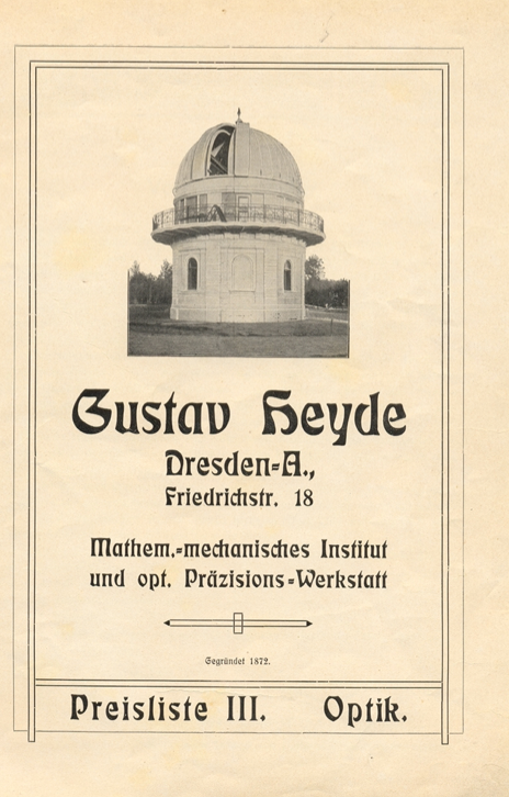 A white building with a dome on it
Description automatically generated