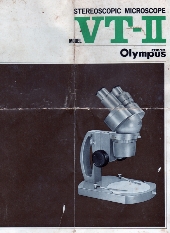 A close-up of a microscope
Description automatically generated