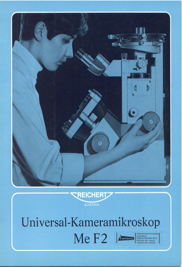 A person looking through a microscope
Description automatically generated