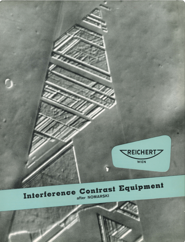 A book cover with a triangle pattern
Description automatically generated