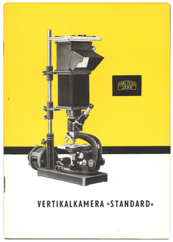 A black and white photo of a microscope
Description automatically generated