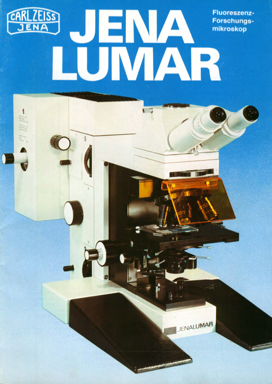 A white and black microscope
Description automatically generated