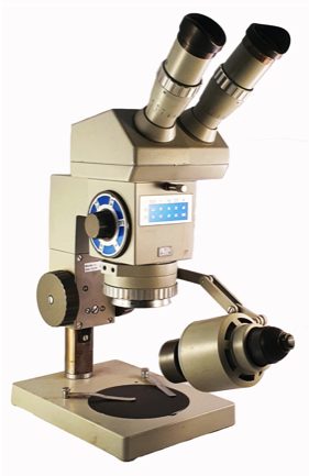 A close-up of a microscope
Description automatically generated