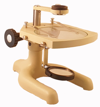 A yellow microscope with a black handle
Description automatically generated