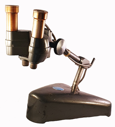 A close-up of a microscope
Description automatically generated